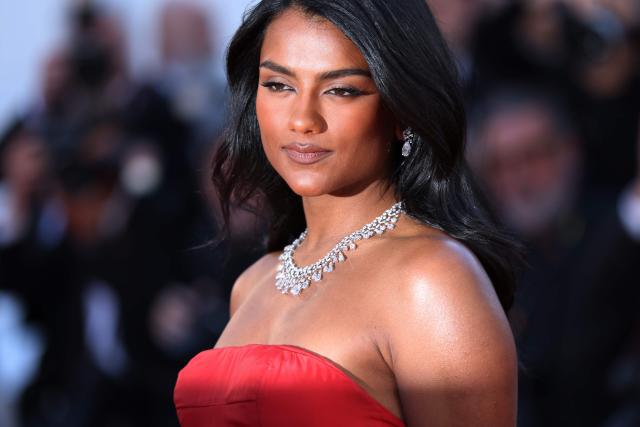 British actress Simone Ashley arrives for the screening of the film "Karma" at the 79th edition of the Cannes Film Festival in Cannes, southern France on May 15, 2026. (Photo by Sameer AL-DOUMY / AFP)