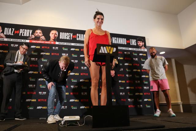 US Mixed Martial Arts (MMA) fighter Gina Carano weighs-in ahead of the Netflix's Rousey vs. Carano bout in Manhattan Beach, California, on May 15, 2026. Carano will face Rousey at the Intuit Dome in Inglewood, California on Saturday night. (Photo by Patrick T. Fallon / AFP)