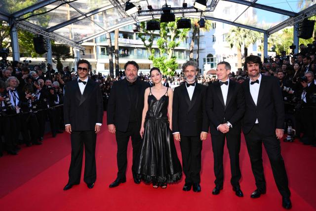 (From L) French musician Maxime Nucci, French actor Denis Menochet, French actress Marion Cotillard, Argentinian actor Leonardo Sbaraglia, French director and screenwriter Guillaume Canet and French screenwriter Simon Jacquet arrive for the screening of the film "Karma" at the 79th edition of the Cannes Film Festival in Cannes, southern France on May 15, 2026. (Photo by Olivier CHASSIGNOLE / AFP)