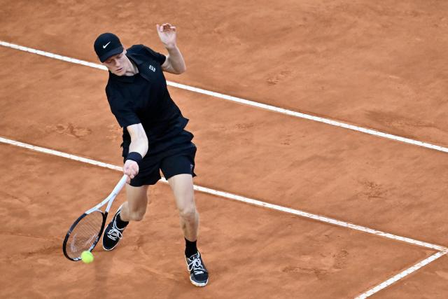 Italy's Jannik Sinner hits a return to Russia's Daniil Medvedev during their semi-final at the ATP Rome Open tennis tournament at Foro Italico in Rome on May 15, 2026. (Photo by Filippo MONTEFORTE / AFP)