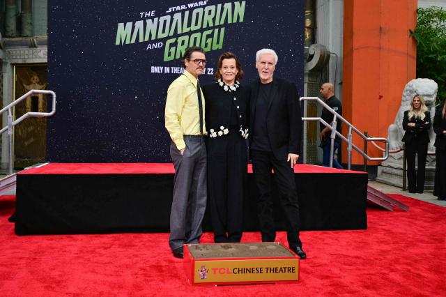 (L/R) Chilean-US actor Pedro Pascal, US actress Sigourney Weaver and US director James Cameron pose after Weaver's hand and footprint ceremony at the TCL Chinese Theatre in Hollywood, California, on May 15, 2026. (Photo by Frederic J. Brown / AFP)