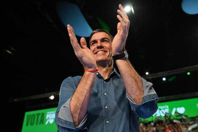 Spain's Prime Minister Pedro Sanchez applauds during the Spanish Socialists Party (PSOE) closing campaign rally for Andalusia regional elections in Seville, May 15, 2026. The Socialists of Prime Minister Pedro Sanchez face a key electoral challenge May 16, 2026 in Andalusia, Spain's most populous region, following a string of defeats to the right wing a year before the general election. (Photo by CRISTINA QUICLER / AFP)