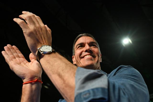Spain's Prime Minister Pedro Sanchez applauds during the Spanish Socialists Party (PSOE) closing campaign rally for Andalusia regional elections in Seville, May 15, 2026. The Socialists of Prime Minister Pedro Sanchez face a key electoral challenge May 16, 2026 in Andalusia, Spain's most populous region, following a string of defeats to the right wing a year before the general election. (Photo by CRISTINA QUICLER / AFP)