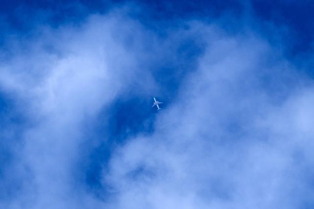 Boeing 777-31H(ER) aircraft by United Arab Emirates' airline Emirates flies over Frankfurt am Main, western Germany, on May 15, 2026.  (Photo by Kirill KUDRYAVTSEV / AFP)