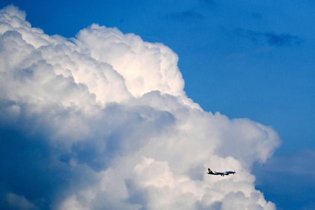 An Embraer E190LR aircraft by Swiss airline Helvetic airways prepares to land at the Frankfurt International Airport, Frankfurt am Main, western Germany, on May 15, 2026.  (Photo by Kirill KUDRYAVTSEV / AFP)