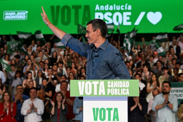 Spain's Prime Minister Pedro Sanchez waves after delivering a speech during the Spanish Socialists Party (PSOE) closing campaign rally for Andalusia regional elections in Seville on May 15, 2026. The Socialists of Prime Minister Pedro Sanchez face a key electoral challenge May 16, 2026 in Andalusia, Spain's most populous region, following a string of defeats to the right wing a year before the general election. (Photo by CRISTINA QUICLER / AFP)