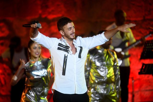 (FILES) Morocco singer Saad Lamjarred performs during the 52 sesion of the International Carthage Festival on July 30, 2016 at the Roman theatre of Carthage near Tunis. Moroccan singer Saad Lamjarred was sentenced on May 15, 2026 to five years in prison by the Draguignan Assize Court for the rape of a young woman he met in Saint-Tropez in 2018. (Photo by FETHI BELAID / AFP)
