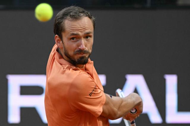 Russia's Daniil Medvedev prepares a return to Italy's Jannik Sinner during their semi-final at the ATP Rome Open tennis tournament at Foro Italico in Rome on May 15, 2026. (Photo by Tiziana FABI / AFP)