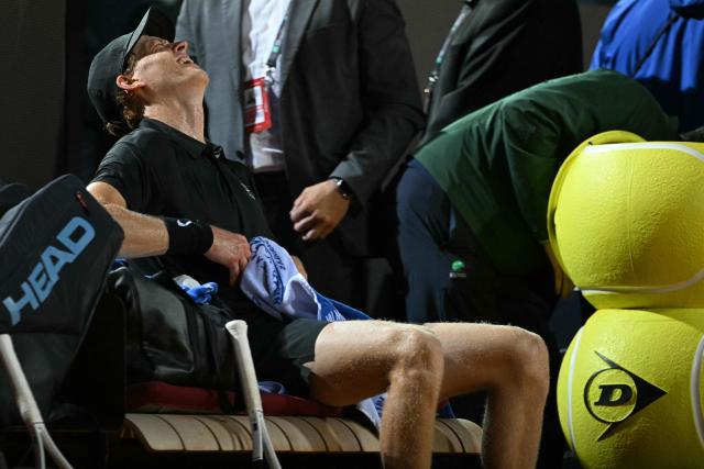 Italy's Jannik Sinner reacts during a break in the semi-final against Russia's Daniil Medvedev at the ATP Rome Open tennis tournament at Foro Italico in Rome on May 15, 2026. (Photo by Tiziana FABI / AFP)