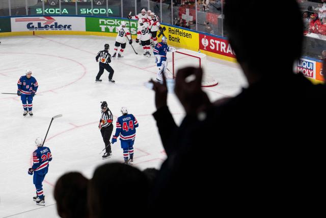 Switzerland's players celebrate after scoring during the group A match between USA and Switzerland at the IIHF Ice Hockey Men's World Championship in the Swiss Life Arena, in Zurich, on May 15, 2026. (Photo by ENNIO LEANZA / AFP)