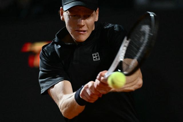 Italy's Jannik Sinner hits a return to Russia's Daniil Medvedev during their semi-final at the ATP Rome Open tennis tournament at Foro Italico in Rome on May 15, 2026. (Photo by Filippo MONTEFORTE / AFP)