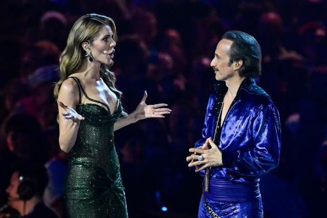 Austrian presenters Michael Ostrowski and Victoria Swarovski stand on stage during the dress rehearsal for the grand final of the Eurovision Song Contest 2026 (ESC) at Wiener Stadthalle in Vienna, Austria on May 15, 2026. (Photo by Tobias SCHWARZ / AFP)