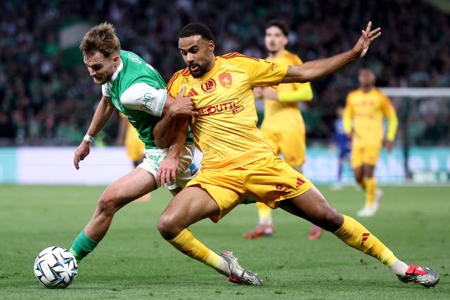 Saint-Etienne's New Zealander midfielder #11 Ben Old (L) fights for the ball with Rodez's French defender #24 Loni Laurent (C) during the French L1-L2 playoff second leg football match between AS Saint-Etienne and Rodez at the stade Geoffroy Guichard in Saint-Etienne, south-eastern France on May 15, 2026. (Photo by Alex MARTIN / AFP)