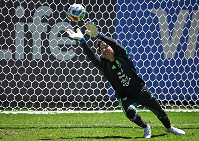 Mexico's football team goalkeeper Guillermo Ochoa stops a ball during a training session in Mexico City on May 15, 2026. (Photo by CARL DE SOUZA / AFP)