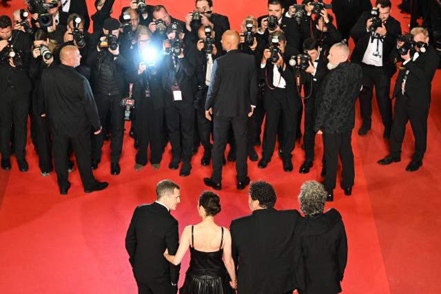 The team of the film "Karma" poses for photographers after its screening at the 79th edition of the Cannes Film Festival in Cannes, southern France on May 15, 2026. (Photo by Antonin THUILLIER / AFP)