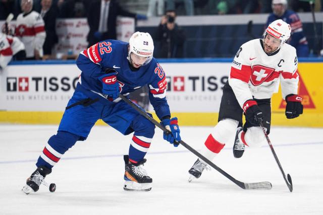 USA's forward #22 Isaac Howard (L) fights for the puck with Switzerland's defender #90 Roman Josi (R) during the IIHF Ice Hockey Men's World Championship first round group A ice hockey match between USA and Switzerland at the Swiss Life Arena, in Zurich, on May 15, 2026. (Photo by ENNIO LEANZA / AFP)