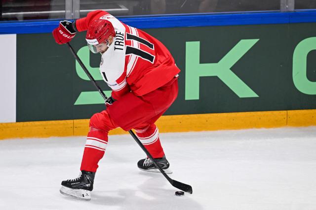 Denmark's forward #11 Alexander True controls the puck during the IIHF Ice Hockey Men's World Championship first round group B ice hockey match between Czech Republic and Denmark at  at BFC Arena, in Fribourg, Switzerland, on May 15, 2026. (Photo by Fabrice COFFRINI / AFP)