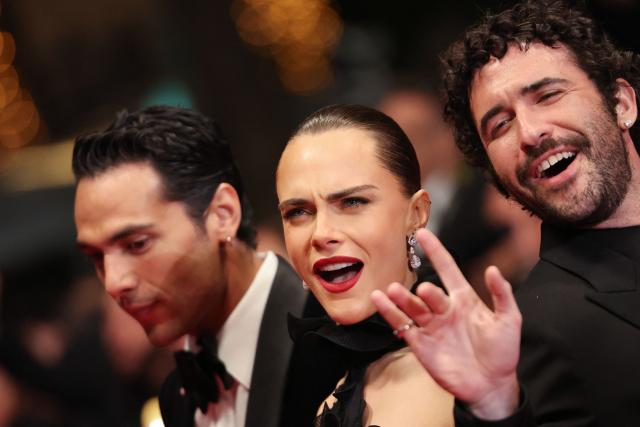(From L) Mexican actor Diego Calva, British model Cara Delevingne and US director and screenwriter Jordan Firstman arrive for the screening of the film "Club Kid" at the 79th edition of the Cannes Film Festival in Cannes, southern France on May 15, 2026. (Photo by Thibaud MORITZ / AFP)