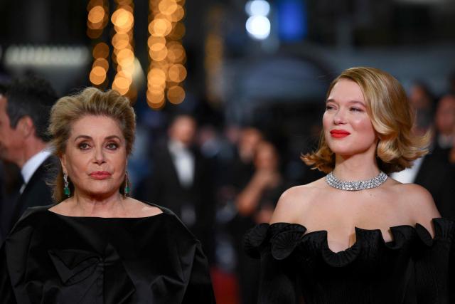 French actress Catherine Deneuve (L) and French actress Lea Seydoux arrive for the screening of the film "Gentle Monster" at the 79th edition of the Cannes Film Festival in Cannes, southern France on May 15, 2026. (Photo by Olivier CHASSIGNOLE / AFP)