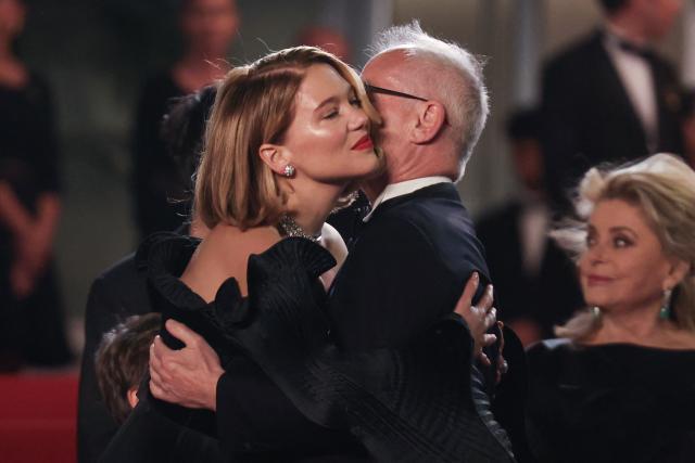 French actress Lea Seydoux (L) and Cannes film festival director Thierry Fremaux embrace upon arrival for the screening of the film "Gentle Monster" at the 79th edition of the Cannes Film Festival in Cannes, southern France on May 15, 2026. (Photo by Thibaud MORITZ / AFP)