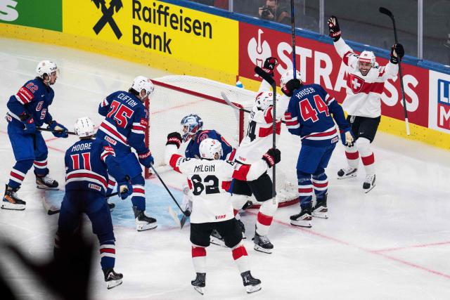 Switzerland's forward #85 Sven Andrighetto (R) celebrates after scoring his team second goal during the IIHF Ice Hockey Men's World Championship first round group A ice hockey match between USA and Switzerland at the Swiss Life Arena, in Zurich, on May 15, 2026. (Photo by ENNIO LEANZA / AFP)