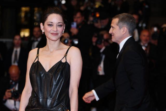 French actress Marion Cotillard and French director and screenwriter Guillaume Canet leaves after the screening of the film "Karma" at the 79th edition of the Cannes Film Festival in Cannes, southern France on May 15, 2026. (Photo by Sameer AL-DOUMY / AFP)