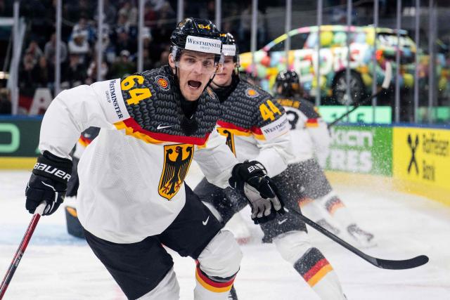 Germany's defender #64 Marcus Weber (L) reacts during the group A match between Finland and Germany at the IIHF Ice Hockey Men's World Championship in the Swiss Life Arena, Zurich, on May 15, 2026. (Photo by ENNIO LEANZA / AFP)