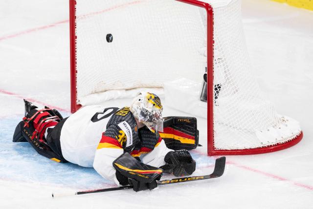Germany's goalkeeper #30 Philipp Grubauer dives as he concedes a goal during the group A match between Finland and Germany at the IIHF Ice Hockey Men's World Championship in the Swiss Life Arena, Zurich, on May 15, 2026. (Photo by ENNIO LEANZA / AFP)