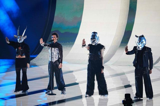 Austrian singer Benjamin Gedeon, aka Cosmo and representing Austria with the song 'Tanzschein', performs during the dress rehearsal for the grand final of the Eurovision Song Contest 2026 (ESC) at Wiener Stadthalle in Vienna, Austria on May 15, 2026. (Photo by GEORG HOCHMUTH / APA / AFP) / Austria OUT