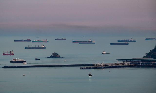 (FILES) Cargo ships wait to transit the Panama Canal in Panama City on April 26, 2026. The Panama Canal Authority, reported on May 15, 2026 that the Panama Canal, through which 5% of the world’s maritime trade passes, is anticipating possible restrictions on ship transit at the end of the year due to the El Niсo phenomenon. (Photo by MARTIN BERNETTI / AFP)