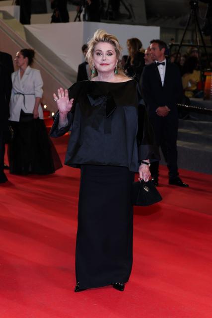 French actress Catherine Deneuve leaves after the screening of the film "Gentle Monster" at the 79th edition of the Cannes Film Festival in Cannes, southern France on May 15, 2026. (Photo by Sameer AL-DOUMY / AFP)