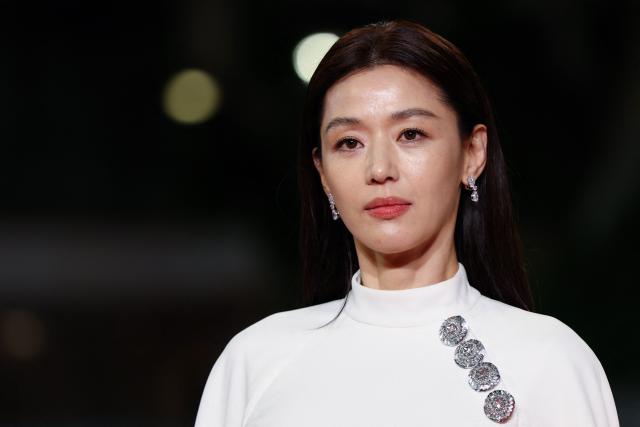 South Korean actor Jun Ji-Hyun arrives for the screening of the film "Gun-Che" (Colony) at the 79th edition of the Cannes Film Festival in Cannes, southern France on May 15, 2026. (Photo by Sameer AL-DOUMY / AFP)