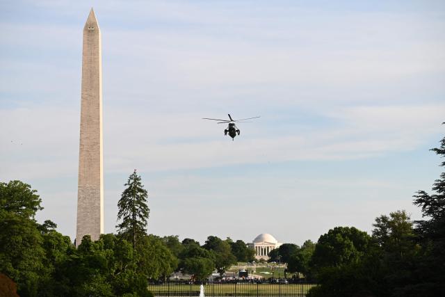 The Washington Monument is seen in the distance as Marine One carrying US President Donald Trump arrives at the White House in Washington, DC, on May 15, 2026. Trump is returning from Beijing where he met with Chinese President Xi Jinping to discuss trade deals in various sectors. (Photo by Alex WROBLEWSKI / AFP)