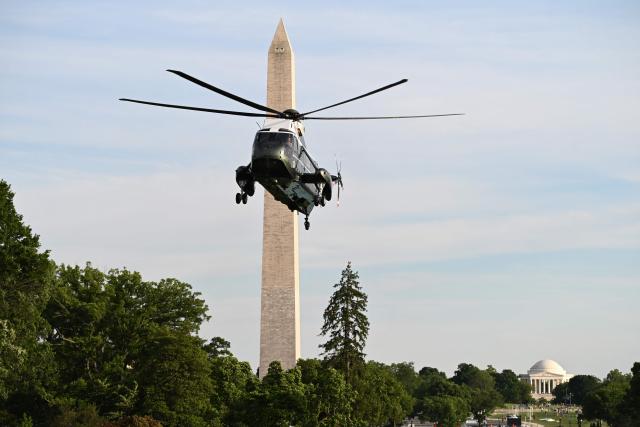 The Washington Monument is seen in the distance as Marine One carrying US President Donald Trump arrives at the White House in Washington, DC, on May 15, 2026. Trump is returning from Beijing where he met with Chinese President Xi Jinping to discuss trade deals in various sectors. (Photo by Alex WROBLEWSKI / AFP)