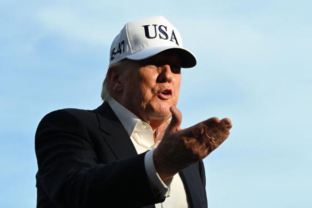 US President Donald Trump gestures as he speaks to reporters after arriving on the South Lawn of the White House in Washington, DC, on May 15, 2026. Trump is returning from Beijing where he met with Chinese President Xi Jinping to discuss trade deals in various sectors. (Photo by Alex WROBLEWSKI / AFP)