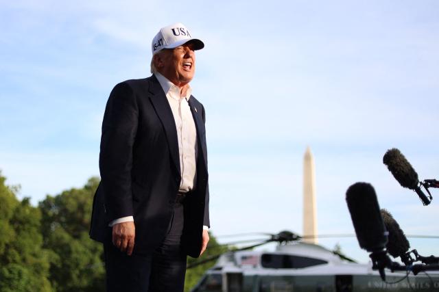 US President Donald Trump speaks to reporters after arriving on the South Lawn of the White House in Washington, DC, on May 15, 2026. Trump is returning from Beijing where he met with Chinese President Xi Jinping to discuss trade deals in various sectors. (Photo by Alex WROBLEWSKI / AFP)