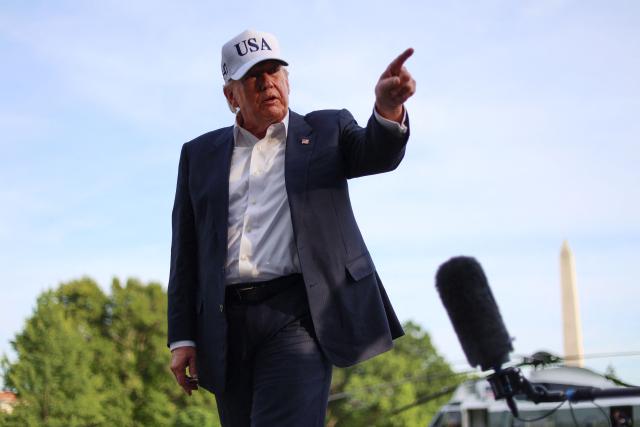 US President Donald Trump gestures as he speaks to reporters after arriving on the South Lawn of the White House in Washington, DC, on May 15, 2026. Trump is returning from Beijing where he met with Chinese President Xi Jinping to discuss trade deals in various sectors. (Photo by Alex WROBLEWSKI / AFP)
