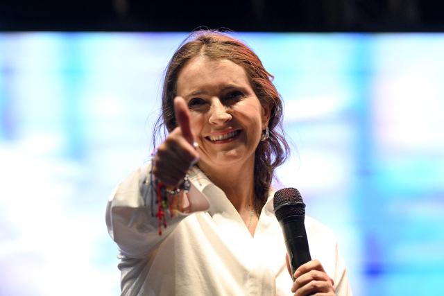 Colombia's presidential candidate Paloma Valencia, of the Centro Democratico party, gestures at supporters during a campaign rally in Cali, Colombia on May 15, 2026. Colombia will hold presidential elections on May 31. (Photo by JOAQUIN SARMIENTO / AFP)