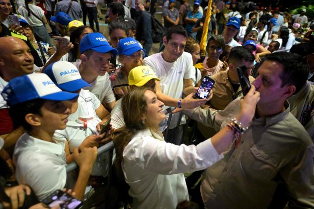 Colombia's presidential candidate Paloma Valencia, of the Centro Democratico party, greets supporters during a campaign rally in Cali, Colombia on May 15, 2026. Colombia will hold presidential elections on May 31. (Photo by Joaquin SARMIENTO / AFP)