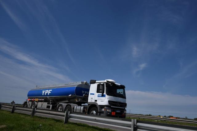 (FILES) An YPF tanker truck drives along a highway in Lima, Buenos Aires province, on September 18, 2025. Argentina's state-owned oil company YPF has applied to participate in a special investment program to develop oil fields in Vaca Muerta (south) at a cost of $25 billion; if approved, this would be the country's largest oil export project, the company announced on May 15, 2026. (Photo by Luis ROBAYO / AFP)