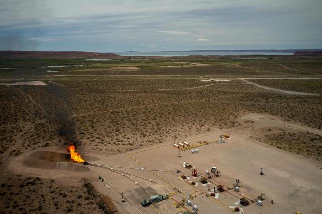 (FILES) Aerial view of a gas deposit near Fortin de Piedra in Anelo, Neuquen province, Argentina, in the Vaca Muerta Formation, on November 27, 2019. Argentina's state-owned oil company YPF has applied to participate in a special investment program to develop oil fields in Vaca Muerta (south) at a cost of $25 billion; if approved, this would be the country's largest oil export project, the company announced on May 15, 2026. (Photo by Emiliano Lasalvia / AFP)