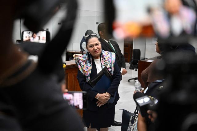 (FILES) Guatemala's attorney general Consuelo Porras (C) speaks to journalists following a meeting of the commission that nominates finalists for the election of the attorney general for the next four-year term at the Supreme Court in Guatemala City on April 9, 2026. Guatemala's attorney general Consuelo Porras said on May 15, 2026, that attempts to discredit her had failed, one day before stepping down amid sanctions from 40 countries, led by the United States, that accuse her of being corrupt and undemocratic. (Photo by JOHAN ORDONEZ / AFP)