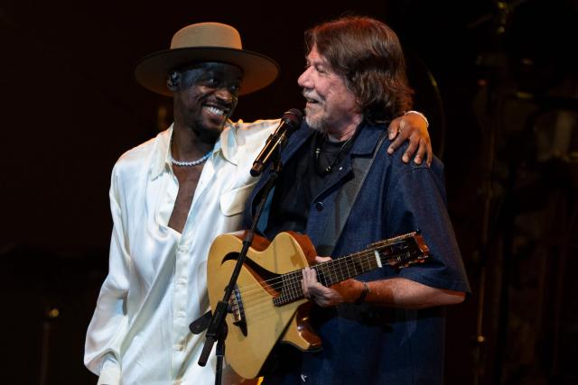 Brazilian musician Jota.pe (L) and guest musician Lenine (R) perform on stage during the "Se o Meu Peito Fosse o Mundo" concert at the Vivo Rio concert hall in Rio de Janeiro, Brazil on May 15, 2026. (Photo by Pablo PORCIUNCULA / AFP)