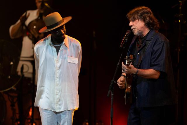 Brazilian musician Jota.pe (L) and guest musician Lenine (R) perform on stage during the "Se o Meu Peito Fosse o Mundo" concert at the Vivo Rio concert hall in Rio de Janeiro, Brazil on May 15, 2026. (Photo by Pablo PORCIUNCULA / AFP)