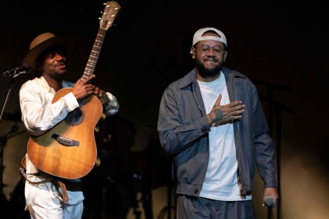Brazilian musician Jota.pe (L) and guest rapper Emicida (R) perform on stage during the "Se o Meu Peito Fosse o Mundo" concert at the Vivo Rio concert hall in Rio de Janeiro, Brazil on May 15, 2026. (Photo by Pablo PORCIUNCULA / AFP)
