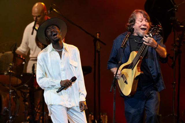 Brazilian musician Jota.pe (L) and guest musician Lenine (R) perform on stage during the "Se o Meu Peito Fosse o Mundo" concert at the Vivo Rio concert hall in Rio de Janeiro, Brazil on May 15, 2026. (Photo by Pablo PORCIUNCULA / AFP)
