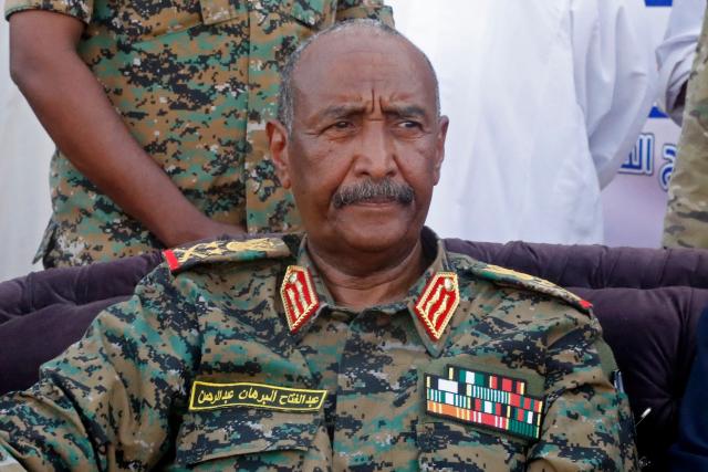Sudan's de facto leader and army chief Abdel Fattah al-Burhan attends the Sudanese Premier League's opening football match between Al Merrikh and Ahli Madani at the Kober Stadium in Khartoum North, on May 15, 2026. Football returned to Sudan's war-scarred capital on May 15 as the domestic league staged its first matches since the conflict began at battered stadiums on the edges of a largely abandoned Khartoum. (Photo by Ebrahim Hamid / AFP)