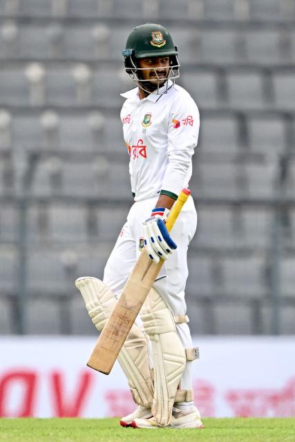 Bangladesh’s Mahmudul Hasan Joy walks back to the pavilion after his dismissal by Pakistan’s Mohammad Abbas during the first day of the second Test cricket match between Bangladesh and Pakistan at the Sylhet International Cricket Stadium in Sylhet on May 16, 2026. (Photo by Munir UZ ZAMAN / AFP)
