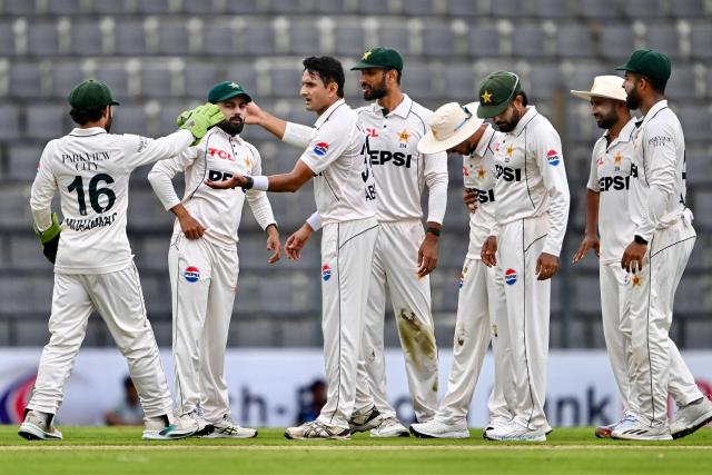 Pakistan’s Mohammad Abbas (3L) celebrates with teammates after taking the wicket of Bangladesh’s Tanzid Hasan during the first day of the second Test cricket match between Bangladesh and Pakistan at the Sylhet International Cricket Stadium in Sylhet on May 16, 2026. (Photo by Munir UZ ZAMAN / AFP)