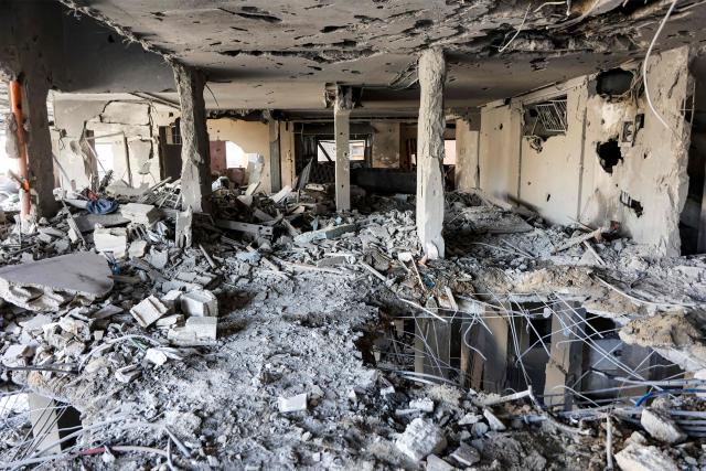 Debris and rubble is pictured in the aftermath of an Israeli strike the previous day on a floor in residential building in the Rimal neighbourhood of Gaza City on May 16, 2026. Israel said on May 15 that it carried out a strike in Gaza targeting Ezzedine Al-Haddad, who described it as chief of the armed wing of Palestinian movement Hamas. Since Hamas's October 7, 2023 attack on Israel, the Israeli military and intelligence services have waged an extensive campaign targeting the group's senior political leaders and militant commanders in Gaza and across the region. (Photo by Omar AL-QATTAA / AFP)